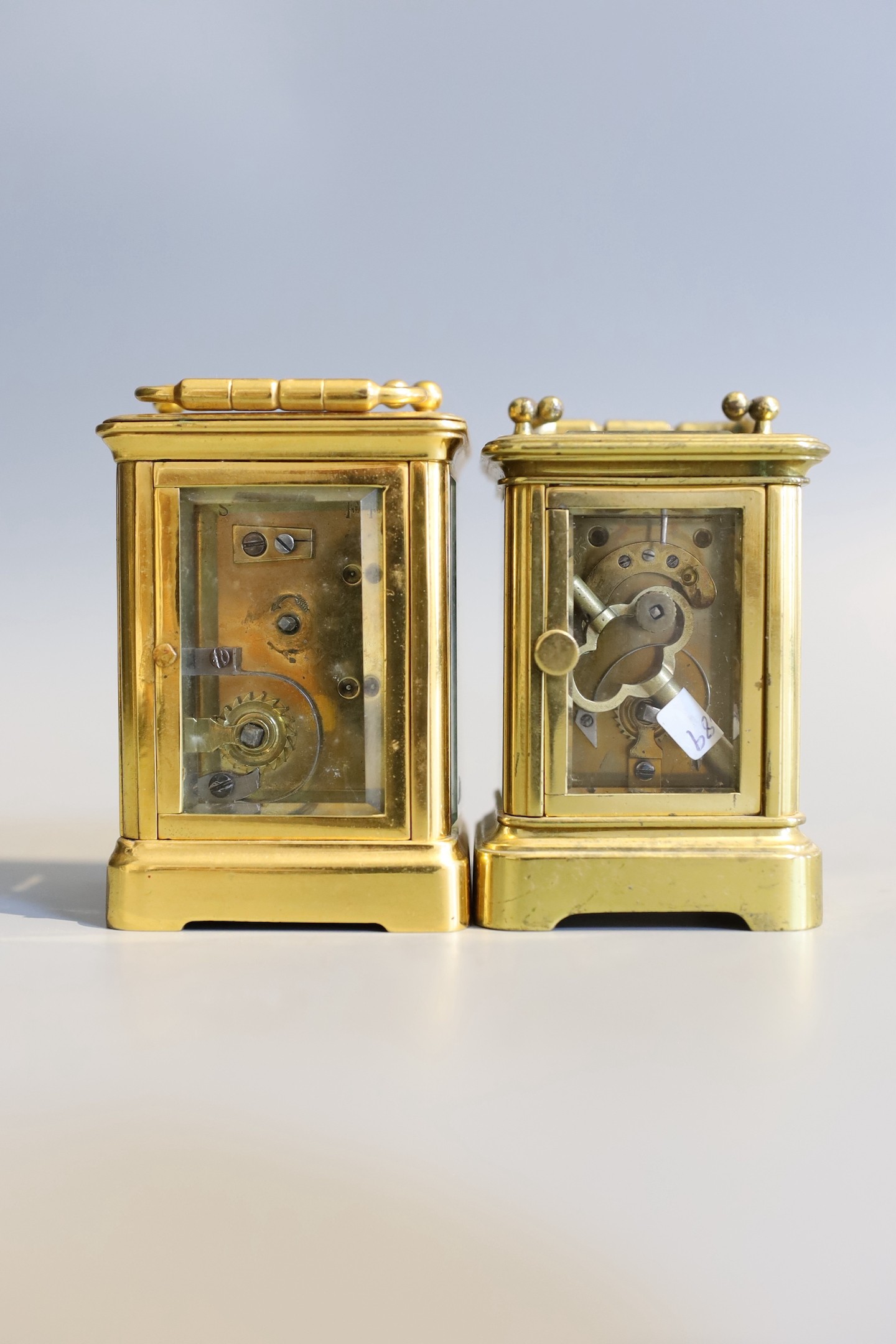 Two late 19th / early 20th century French lacquered brass miniature carriage timepieces, tallest 7cm